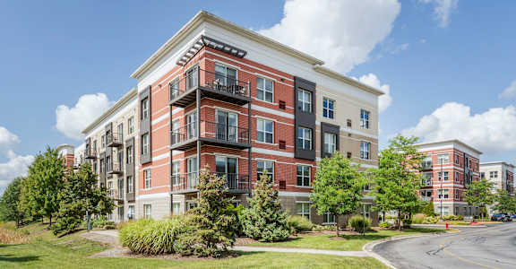 a building with a street in front of it at Avant at the Arboretum, Lisle, Illinois 60532
