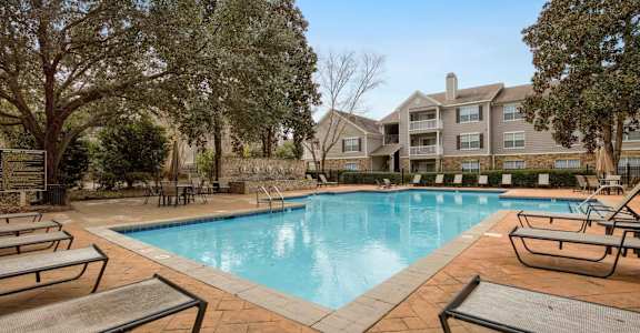 our apartments offer a swimming pool with our apartment buildings in the background