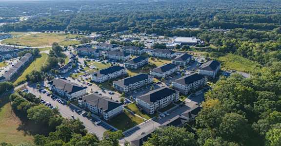 A bird's eye view of a large residential complex surrounded by trees at Waterleaf at Neely Ferry Apartments, Simpsonville, SC 29680