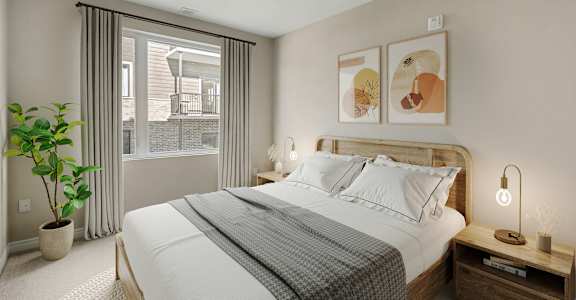 A bedroom with a large bed, a potted plant, and a window with curtains.