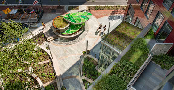 an aerial view of a garden and fountain in the middle of a building