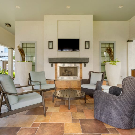 a living room with furniture and a fireplace at Summerwind in Texas 77584