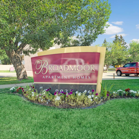 The exterior sign of Broadmoor Apartment Homes. 