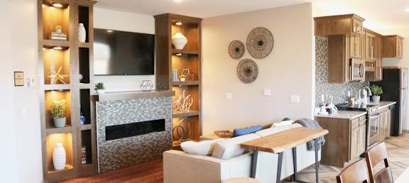 a living room with a couch and a table  at Timber Ridge, Forest Lake, 55025