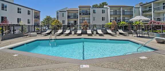 a swimming pool in front of an apartment building at Delphine on Diamond, CA, 94131
