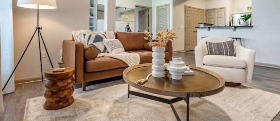 a living room with couches and a coffee table at Reserve by the Lake in Houston, 77084