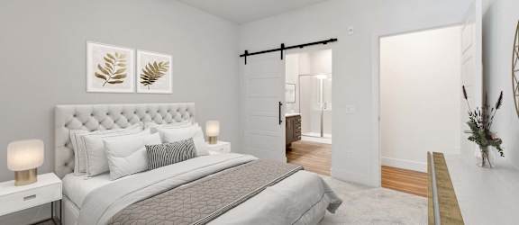 A bedroom with a large bed and a ceiling fan.