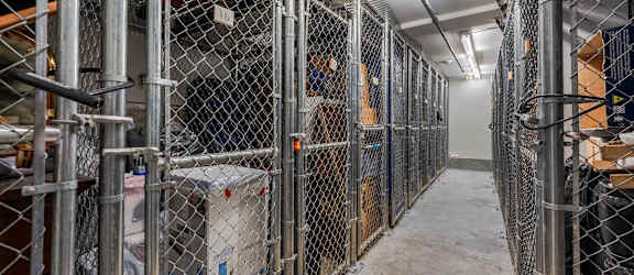 A long corridor with metal fences on both sides.