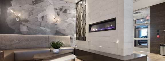 a living room with a couch and a table at Apartments at Denver Place, Colorado