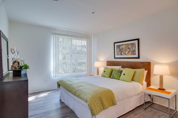 a bedroom with a bed and a window at L'Estancia, Studio City, CA, 91604
