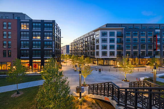 A modern building complex with a bridge connecting two buildings. at Coda at Bryant Street, Washington, DC 20002