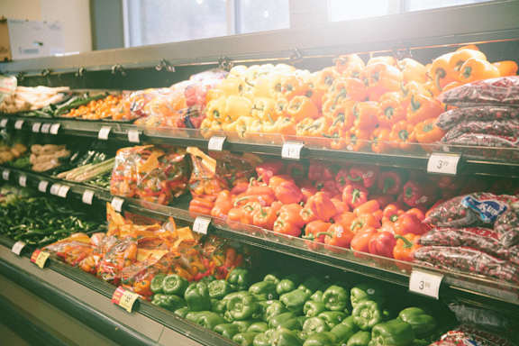 a display of fruits and vegetables in a grocery store