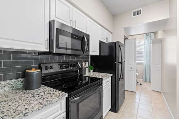 Kitchen with Stainless Steel Appliances at Verona at Boynton Beach Apartments in Boynton Beach, FL 33426