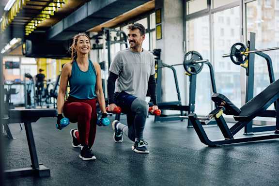 a woman and man doing exercise at Skye at Belltown Apartments, Washington 98121