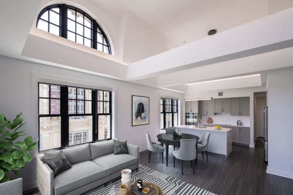 a rendering of a living room and kitchen in an apartment at the Belden Stratford in IL 60614