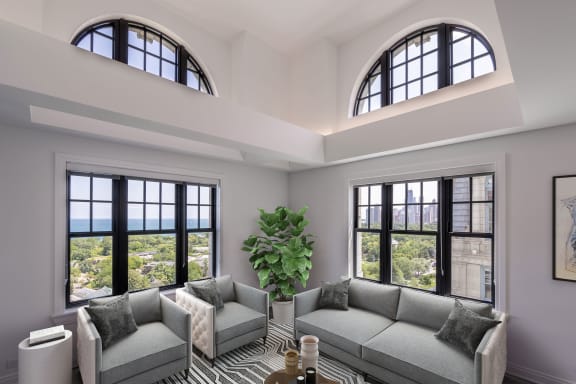 a living room with two couches and two windows at the Belden Stratford in Illinois 60614