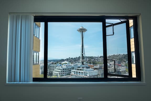 A view of the Space Needle from a window at Skye at Belltown Apartments in Seattle, WA 98121