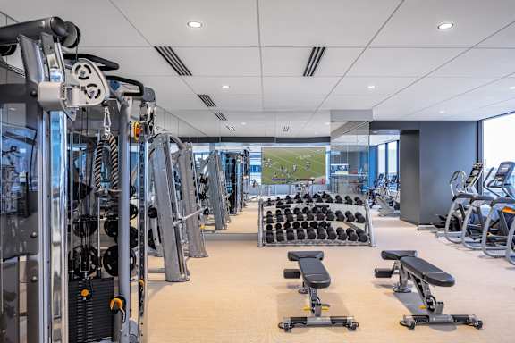 Gym with a variety of equipment including treadmills, weights, and benches at 365 Nicollet, Minneapolis