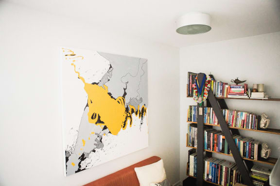 a painting of a map on a wall in a living room