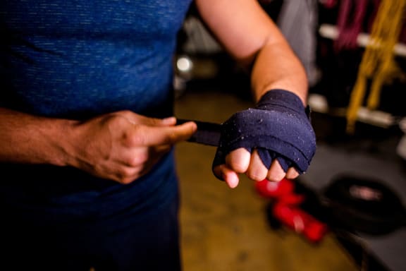 a person holding a glove in their hand
