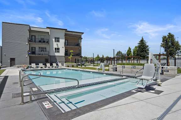 Swimming Pool And Relaxing Area at The Flats at Riverwoods, Utah
