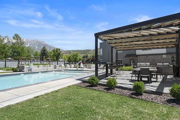 Backyard with a Pool at The Flats at Riverwoods, Utah, 84604