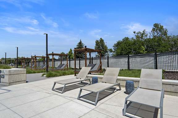 Patio with Lounge Chairs at The Flats at Riverwoods, Provo