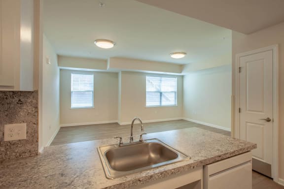 a kitchen with granite counter tops and a sink
