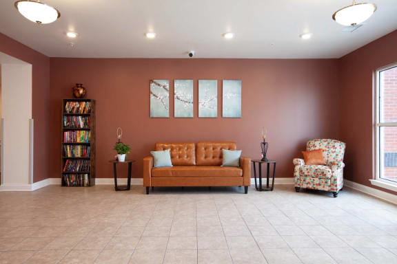 a living room with a couch and two chairs