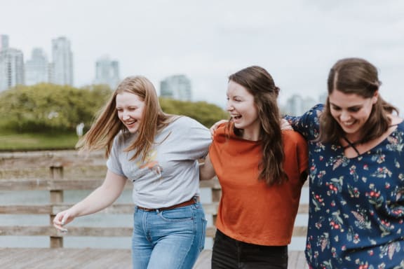 a picture of three girls laughing