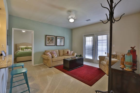 a living room with a couch and a table at Mariposa at Elk Drive, Burleson Texas