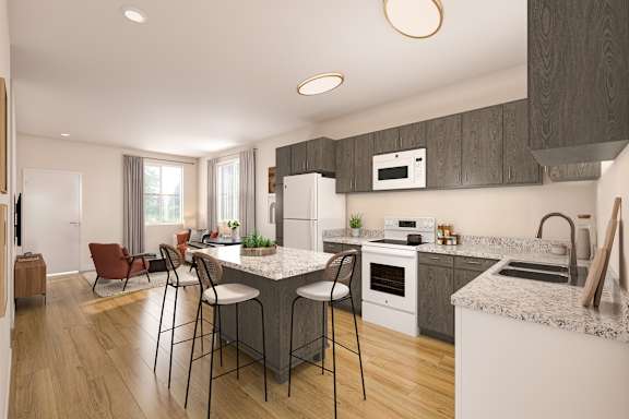 A modern kitchen with a large island and bar stools.