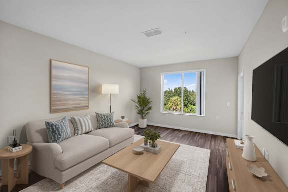 A living room with a couch, a coffee table, and a painting on the wall.