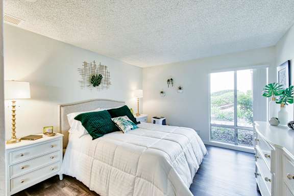 a bedroom with a large bed and a window at Mediterranean Village Costa Mesa, Costa Mesa, CA, 92626