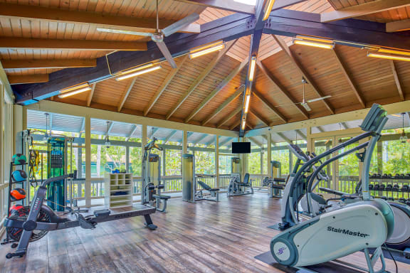 a gym with weights and other equipment in a resort