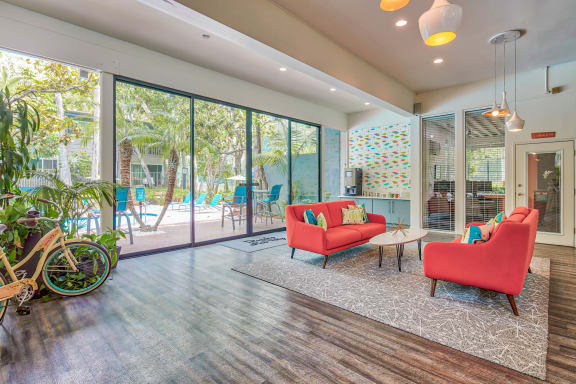 a living room with a couch and chairs and a patio  at Rancho Los Feliz, Los Angeles, CA