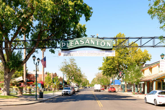 a city street with a sign for pleasanton at Valley Plaza Villages, Pleasanton, 94566