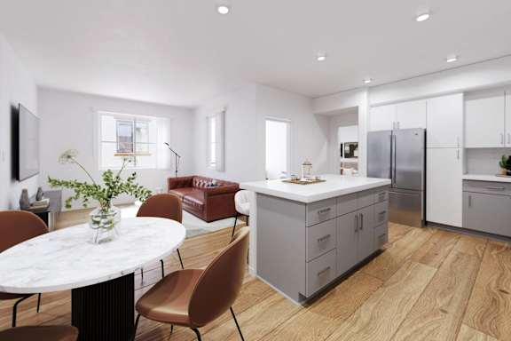 A modern kitchen with a dining table and chairs.