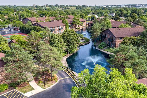 Swimming pool surrounded by modern apartment buildings at TLC Grand Apartments, Deerfield, IL 60015