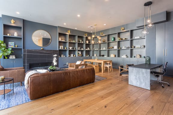 A living room with blue walls and hardwood floors at Mariposa on 3rd, Los Angeles, CA 90004