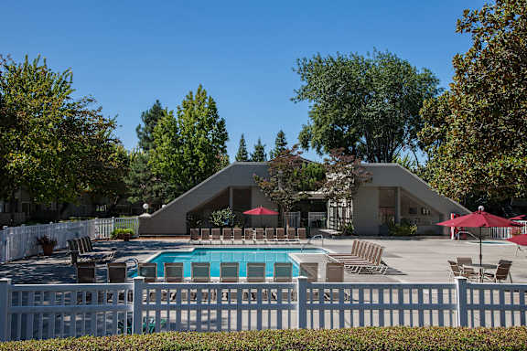 A house with a pool in the backyard.