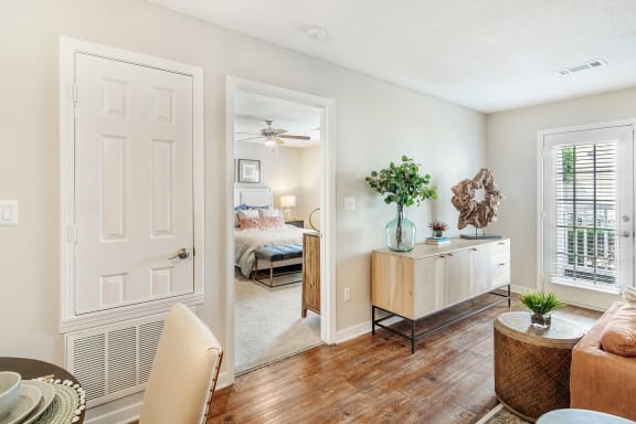 a rendering of a living room with a kitchen in the background at Reserve of Jackson Apartment Homes, Jackson, 39211