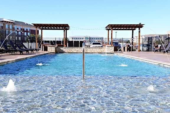 the pool is heated and has views of the mountains and the sky