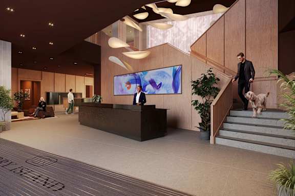 A reception area with a receptionist and a dog.