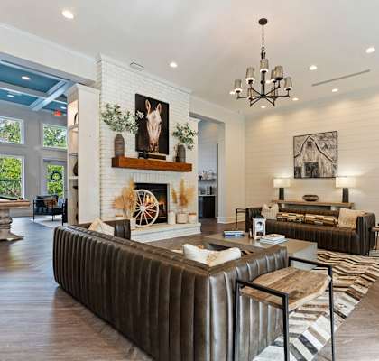 A living room with a fireplace and a couch.