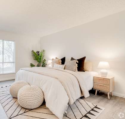 a bedroom with a large bed and a rug at Alosta Place, Azusa, 91702