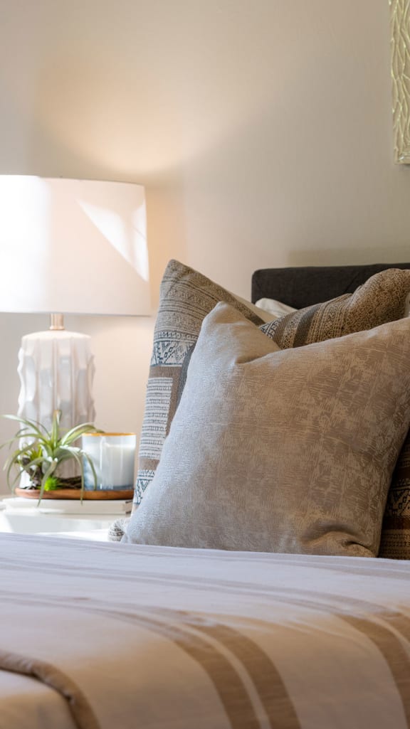 Bed with pillows at Amity Oak in Amityville, NY 11701