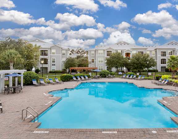 Resort-style swimming pool with expansive pool deck - Courtney Station Apartments
