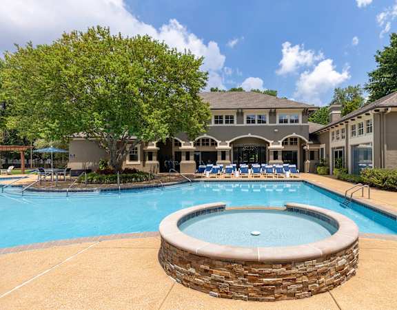 Resort-style swimming pool with heated spa - The Estates at River Pointe