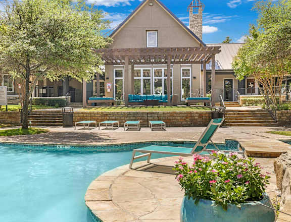 A house with a pool in the backyard.